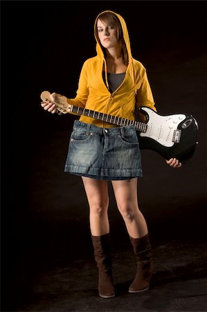 simsearch:685-02940330,k - Young female covering herself with skirt hanging from guitar Fotografie stock - Microstock e Abbonamento, Codice: 400-05038129