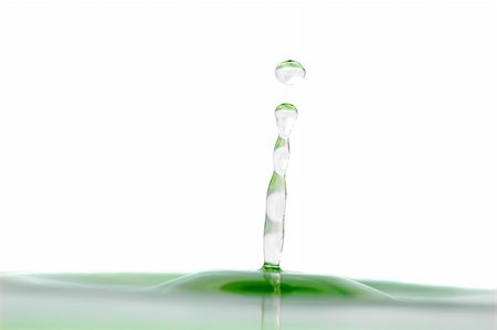 simsearch:400-04057916,k - isolated water droplet with splash and a green tint Photographie de stock - Aubaine LD & Abonnement, Code: 400-05038516