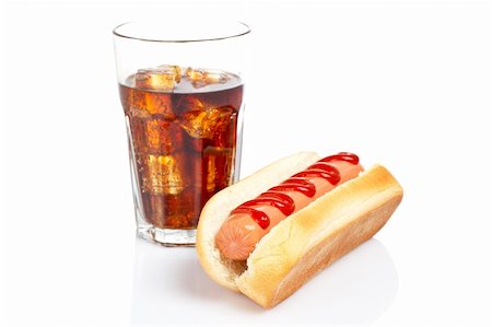 A hot dog and soda glass reflected on white background. Shallow DOF Stock Photo - Budget Royalty-Free & Subscription, Code: 400-05038585