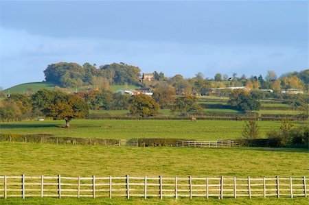 prior - A view over farmland with clouds trees ploughed earth soil agriculture. Stock Photo - Budget Royalty-Free & Subscription, Code: 400-05038609