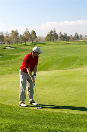 Golfers and a resort golf course in action Photographie de stock - Aubaine LD & Abonnement, Code: 400-05038622