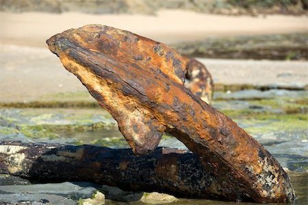 A large anchor from a 1800's sailing ship that was shipwrecked on the rocks Stock Photo - Budget Royalty-Free & Subscription, Code: 400-05039110