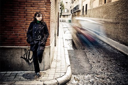simsearch:400-05064591,k - Woman on wall in urban background. Stock Photo - Budget Royalty-Free & Subscription, Code: 400-05039154