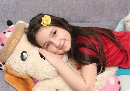 The nice girl lays on the big soft toy Photographie de stock - Aubaine LD & Abonnement, Code: 400-05039846