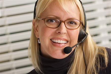simsearch:400-04001946,k - Attractive businesswoman talks on her phone headset. Foto de stock - Super Valor sin royalties y Suscripción, Código: 400-05039906