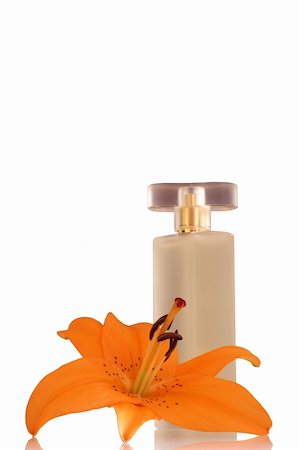 bottle of perfume with an orange lily Foto de stock - Super Valor sin royalties y Suscripción, Código: 400-05030065