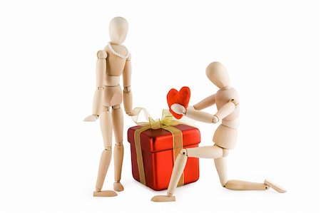 simsearch:400-05294518,k - Little wooden Man offering his heart to a little wooden woman. Valentine's day card. Isolated on white background.  Clipping path included. Fotografie stock - Microstock e Abbonamento, Codice: 400-05030182