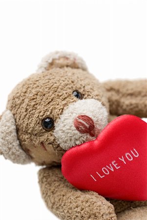 furry teddy bear - Teddy bear holding red heart - selective focus on the eye and on 'I love you" inscription. Stock Photo - Budget Royalty-Free & Subscription, Code: 400-05030628