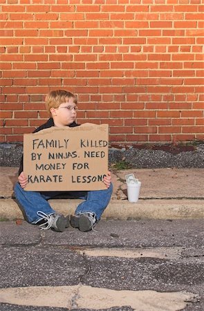 A young boy raising money for karate lessons. Stock Photo - Budget Royalty-Free & Subscription, Code: 400-05030832