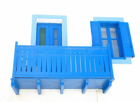 A blue balcony, a blue door, and a blue window in the island of Nisyros, Greece Stock Photo - Budget Royalty-Free & Subscription, Code: 400-05030991