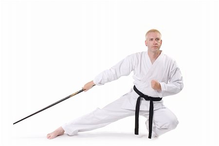 simsearch:400-04558212,k - First Degree Black Belt with staff. Stock Photo - Budget Royalty-Free & Subscription, Code: 400-05031205