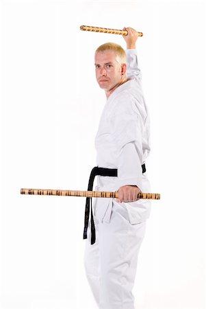 simsearch:400-04558215,k - First Degree Black Belt stick fighting. Photographie de stock - Aubaine LD & Abonnement, Code: 400-05031206