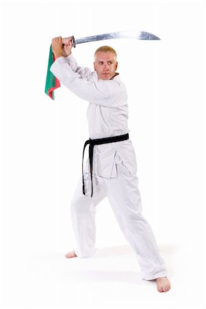 simsearch:400-04558215,k - First Degree Black Belt with Chinese broadsword sword. Photographie de stock - Aubaine LD & Abonnement, Code: 400-05031207