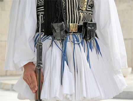 soldier standing with gun - Details from the traditional costume of a presidential guard in Athens, Greece Stock Photo - Budget Royalty-Free & Subscription, Code: 400-05031221