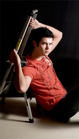 Late teens male model in t-shirt and dramatic lighting Foto de stock - Royalty-Free Super Valor e Assinatura, Número: 400-05031358