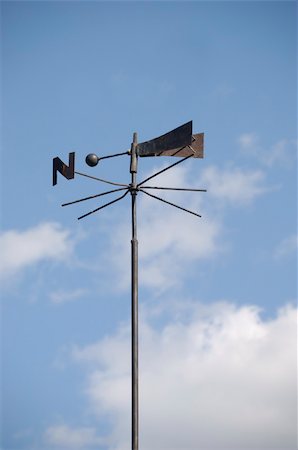 photos of cock wind direction - Old metal weathercock over sky and clouds Stock Photo - Budget Royalty-Free & Subscription, Code: 400-05031483