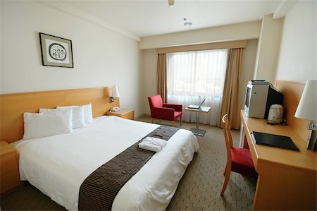 A clean and spartan hotel room Photographie de stock - Aubaine LD & Abonnement, Code: 400-05031698