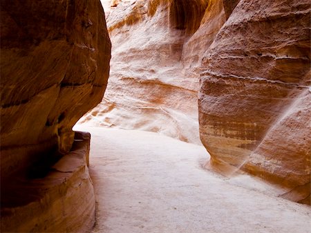 Nabatean aqueduct  in Petra (Al Khazneh), Jordan.  Carved in rocks all through the Siq canyon. Ruins from Roman empire time. Photographie de stock - Aubaine LD & Abonnement, Code: 400-05031794