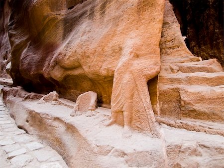 simsearch:400-04497075,k - Nabatean aqueduct  in Petra (Al Khazneh), Jordan.  Carved in rocks all through the Siq canyon. Ruins of camel sculpture from Roman empire time. Photographie de stock - Aubaine LD & Abonnement, Code: 400-05031797