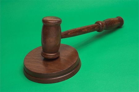simsearch:400-08624071,k - judge's gavel,close up over green background Stock Photo - Budget Royalty-Free & Subscription, Code: 400-05031876