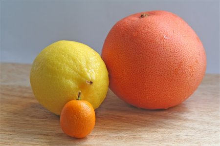 trio of citrusy goodness - lemon kumquat and grapefruit Stock Photo - Budget Royalty-Free & Subscription, Code: 400-05031937