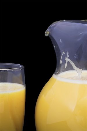 simsearch:695-05770968,k - Orange juice in a drinking glass and a pitcher. Photographie de stock - Aubaine LD & Abonnement, Code: 400-05031967