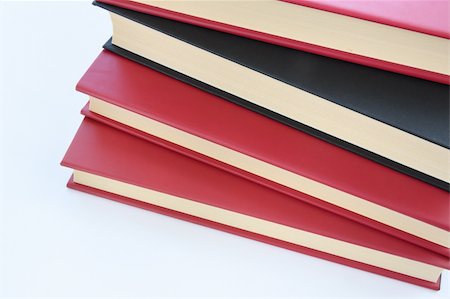 simsearch:400-04480816,k - Red and black books stacked on top of eachother isolated on white background Photographie de stock - Aubaine LD & Abonnement, Code: 400-05032023