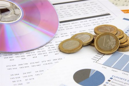 simsearch:400-04644624,k - business background: Financial reports, euro coins and a CD (focus on the coins) Photographie de stock - Aubaine LD & Abonnement, Code: 400-05032030