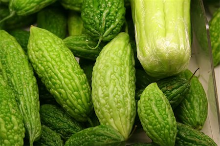 A tray of bitter gourds in a market. Stock Photo - Budget Royalty-Free & Subscription, Code: 400-05032110