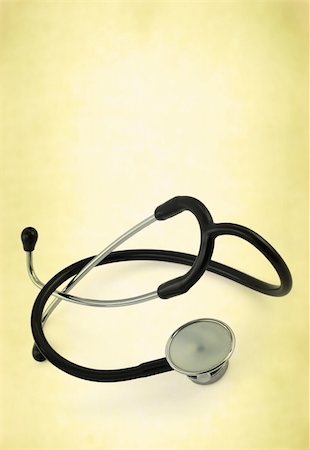 close-up of stethoscope against old-fashioned abstract background Stock Photo - Budget Royalty-Free & Subscription, Code: 400-05032423