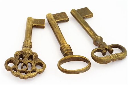 simsearch:400-04955795,k - close-up of three ornamented old keys isolated on white background Stock Photo - Budget Royalty-Free & Subscription, Code: 400-05032763