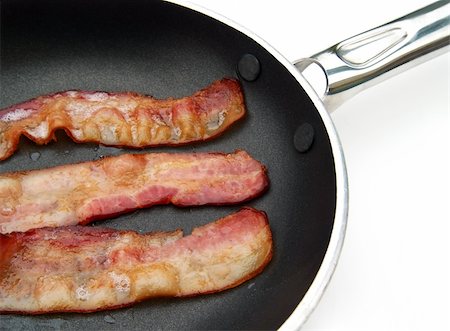 frying pan with bacon - bacon frying in a skillet Stock Photo - Budget Royalty-Free & Subscription, Code: 400-05033350