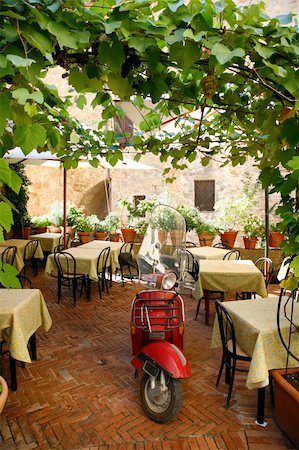 restaurants in tuscany italy - Old scooter parked in a closed restaurant - Pienza - Tuscany - Italy. Stock Photo - Budget Royalty-Free & Subscription, Code: 400-05044196
