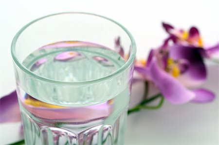 fresh spring drinking water - A glass of water and a flower Stock Photo - Budget Royalty-Free & Subscription, Code: 400-05044701