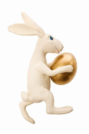 simsearch:400-05040794,k - White toy rabbit with gold egg.The image contains a path Stock Photo - Budget Royalty-Free & Subscription, Code: 400-05044902