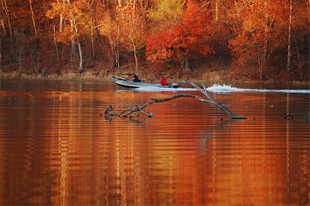 simsearch:400-05257169,k - Gorgeous fall red and gold leaves reflected in the ripples of a lake Stock Photo - Budget Royalty-Free & Subscription, Code: 400-05045021