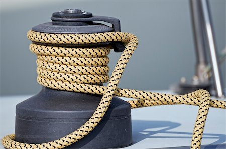 Rope rolled up on a winch in a sailboat Stock Photo - Budget Royalty-Free & Subscription, Code: 400-05045399