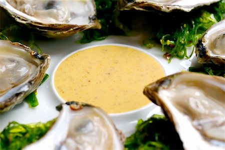french cafe dining table - Image of oysters on garnish with sauce Stock Photo - Budget Royalty-Free & Subscription, Code: 400-05045499