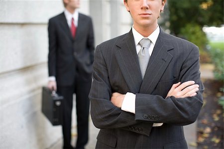 simsearch:400-05118165,k - two businessmen standing in front of building wearing suits looking at camera Stock Photo - Budget Royalty-Free & Subscription, Code: 400-05046053