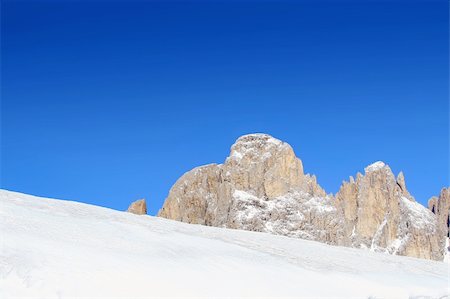 snow rocks and nice mountians over blue sky Stock Photo - Budget Royalty-Free & Subscription, Code: 400-05046065