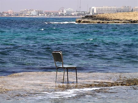 Abandoned old chair laying next to the ocean Stock Photo - Budget Royalty-Free & Subscription, Code: 400-05046093