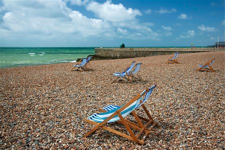 england brighton not people not london not scotland not wales not northern ireland not ireland - pebble beach with striped canvas deckchairs, brighton, england Stock Photo - Budget Royalty-Free & Subscription, Code: 400-05046105