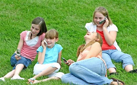 Group of Girls Talking Using Cell Phones Stock Photo - Budget Royalty-Free & Subscription, Code: 400-05046435