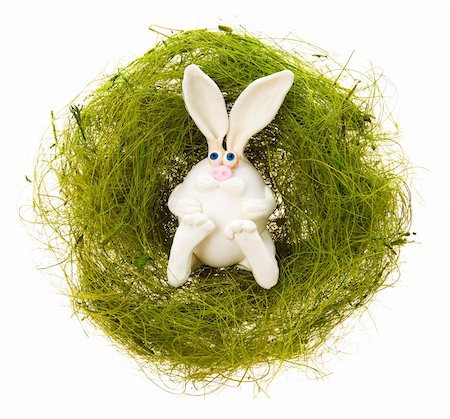 simsearch:400-05040794,k - Easter toy white rabbit in a nest from a green grass on a white background Stock Photo - Budget Royalty-Free & Subscription, Code: 400-05047408