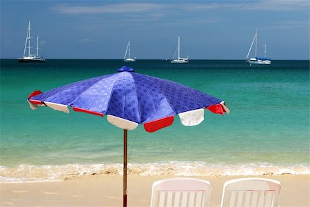 simsearch:700-00555130,k - Beach umbrella and chairs overlooking the ocean on a summer day. Fotografie stock - Microstock e Abbonamento, Codice: 400-05047780