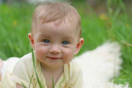 simsearch:400-04825533,k - Cute small boy in green grass - he smiles and has fun Stock Photo - Budget Royalty-Free & Subscription, Code: 400-05048029