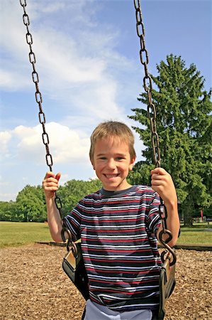 simsearch:400-05045912,k - Cute Little Boy Swinging on a Beautiful Day Stock Photo - Budget Royalty-Free & Subscription, Code: 400-05048139