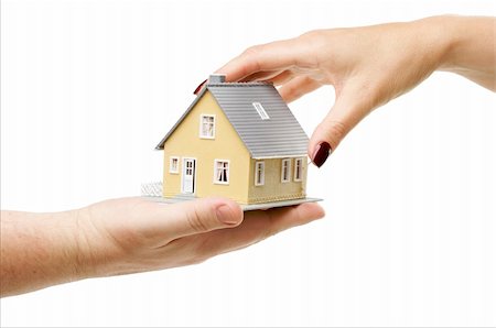 simsearch:628-05818023,k - Female hand reaching for a house isolated on a white background. Foto de stock - Super Valor sin royalties y Suscripción, Código: 400-05048183