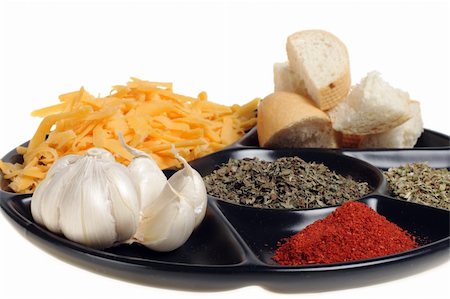 produce to fondue grated cheese garlic ground paprika origanum basil and slice of bread on black plate Photographie de stock - Aubaine LD & Abonnement, Code: 400-05048333