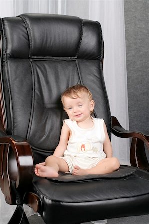 simsearch:400-04093413,k - Very important small kid sits on real boss leather chair Stock Photo - Budget Royalty-Free & Subscription, Code: 400-05048686